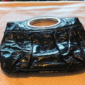 Nice looking clutch with metal handle and snap inside,  real clean, like new